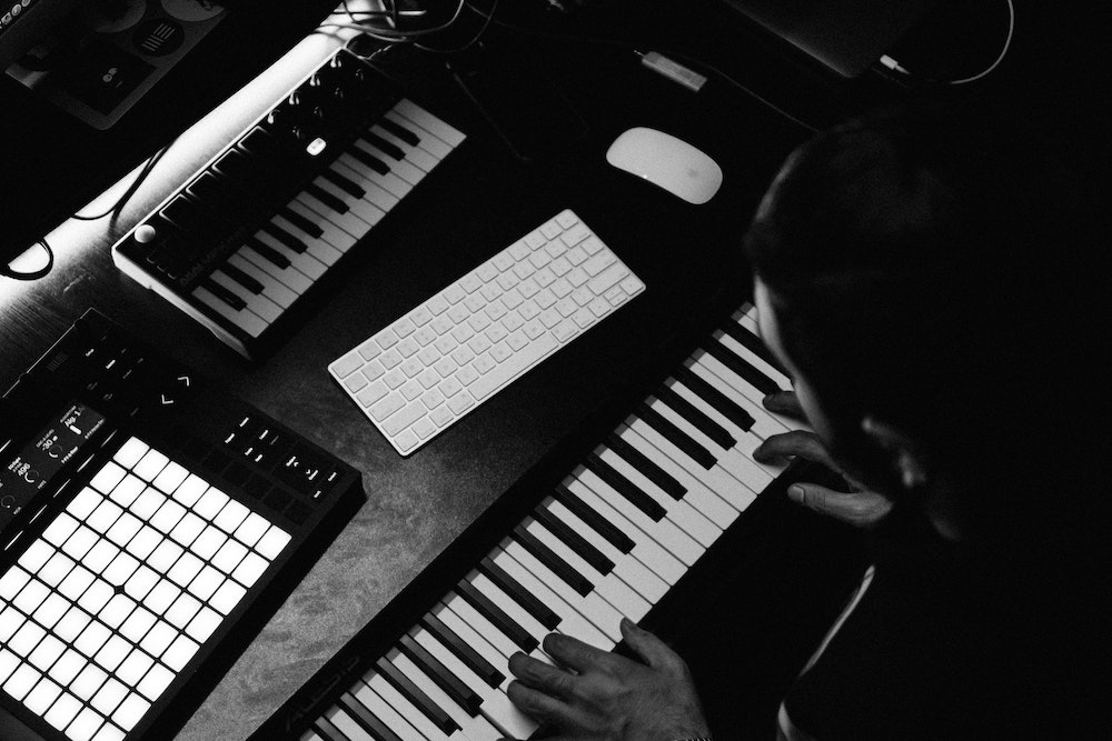 Person playing a MIDI keyboard